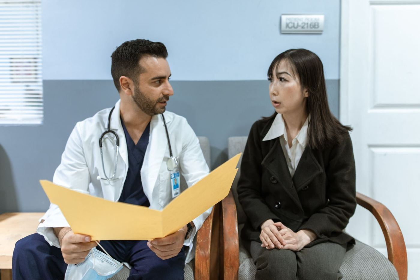 Clinician consulting with a patient during a post-accident evaluation